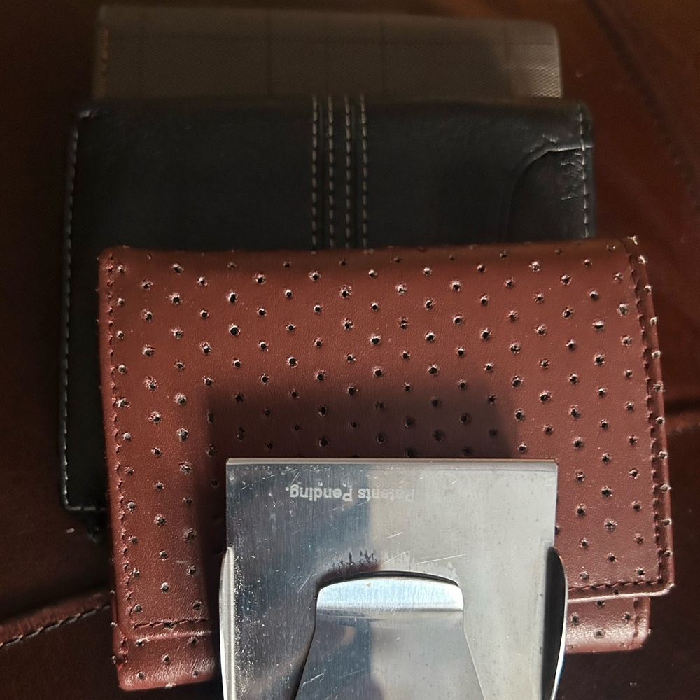 Three Elegant Brown, Black, green wallets and a Money Clip